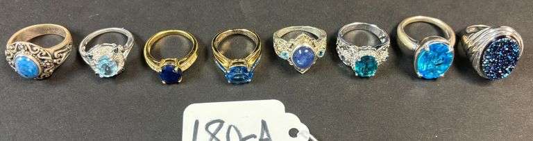 8 STERLING SILVER RINGS W/ BLUE TOPAZ AND SAPPHIRE STONES, OTHER BLUE STONES, VARYING STYLES - 51.87 GRAMS, 1.66 TROY OZ W/ STONES - SIZES RANGE FROM 5-8 image