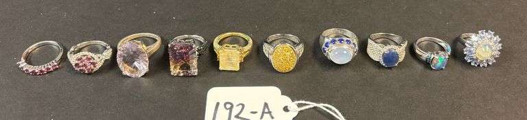 10 STERLING SILVER RINGS W/ OPAL STONES, AMETHYST TYPE, RUBY, AND OTHER ASSORTED STONES, VARYING STYLES OF RINGS - 54.75 GRAMS, 1.76 TROY OZ - SIZES 5-8 image