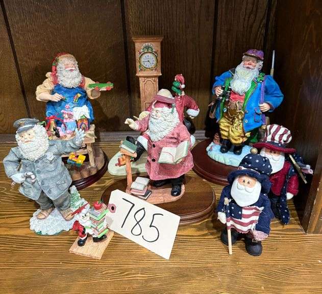 ASSORTED SANTAS: PROFESSIONAL SANTA - THE POLICEMAN, HAMILTON GIFTS, PROFESSIONAL SANTA - THE TEACHER, UNMARKED SANTA HUNTING FIGURE, ETC. (TALLEST FIGURE IS 8 INCHES FOR REFERENCE) image