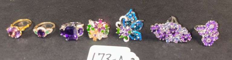 7 STERLING SILVER RINGS, PURPLE AMETHYST AND OTHER COLOR STONES - 1.40 TROY OZ, 43.84 GRAMS - SIZES RANGE FROM 6-7 image