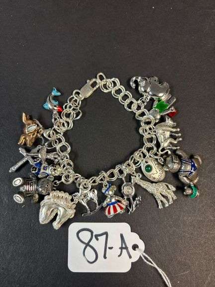 STERLING SILVER 925 CHARM BRACELET W/ CHARMS, W/ APPROX. 16 CHARMS - 2.5 TROY OZ, 80.32 GRAMS image