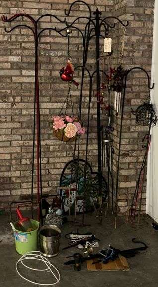 ASSORTED GARDEN AND YARD ITEMS INCLUDING METAL PLANT HANGERS, SHEPHERD'S HOOKS, PLANT STANDS, DECORATIVE TRELLIS, WIND CHIMES, GARDEN STAKES, LAMP SHADE FRAME, BUCKETS, METAL PLANTERS, OTHER PLANT HOOKS, DECORATIVE CARDINAL AND ANGEL ORNAMENTS image