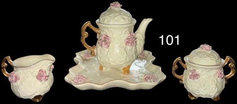 ORNATE CERAMIC TEA SET WITH GOLD TRIM AND APPLIED PINK ROSES INCLUDING TEAPOT, CREAMER, COVERED SUGAR BOWL, AND SERVING TRAY image