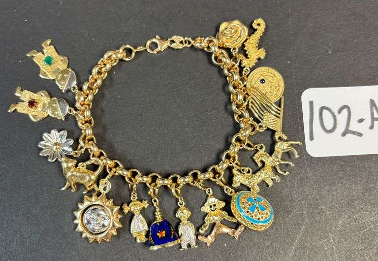 14K YELLOW GOLD CHARM BRACELET W/ 16 14K CHARMS - 1.26 TROY OZ, 39.31 GRAMS TOTAL WEIGHT W/ STONES & DECOR image