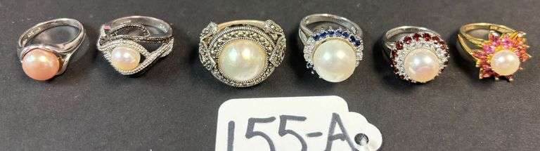 6 CULTURED PEARLS RINGS, 1 STARBURST DESIGN, 1 W/ RUBY STONES, 1 SAPPHIRE STONES - 38.95 GRAMS, 1.25 TROY OZ WITH STONES - SIZES RANGE FROM 5-7 image
