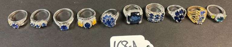 10 STERLING SILVER RINGS W/ BLUE TOPAZ AND SAPPHIRE TYPE STONES, VARYING STYLES - 57.61 GRAMS, 1.85 TROY OZ INCLUDING STONES - SIZES RANGE 6-8 image