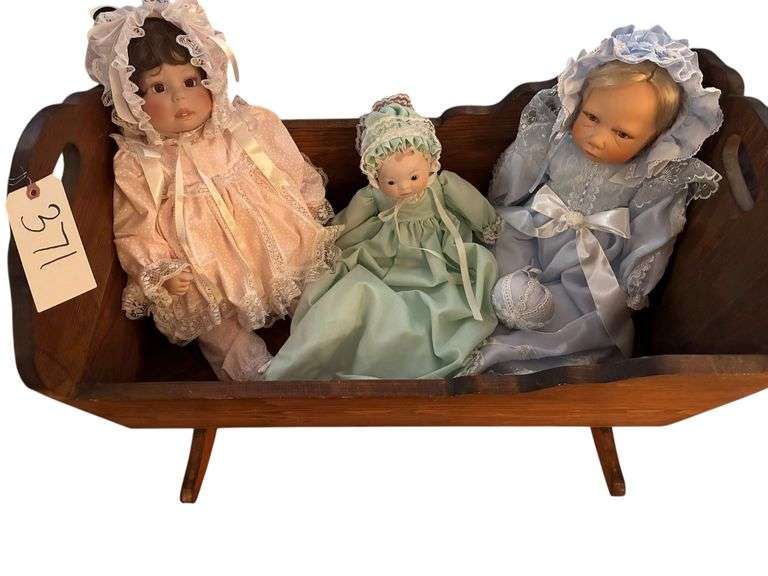 LIFESIZE WOOD BABY CRADLE HOLDS 3 PORCELAIN DOLLS - CRADLE MEASURES 29.5" LONG X 16.75" WIDE X 20" TALL - SPECIAL NOTE: THE DOLL TO THE LEFT IS GRACIE MAE DESIGNED BY THE LATE LEE MIDDLETON image