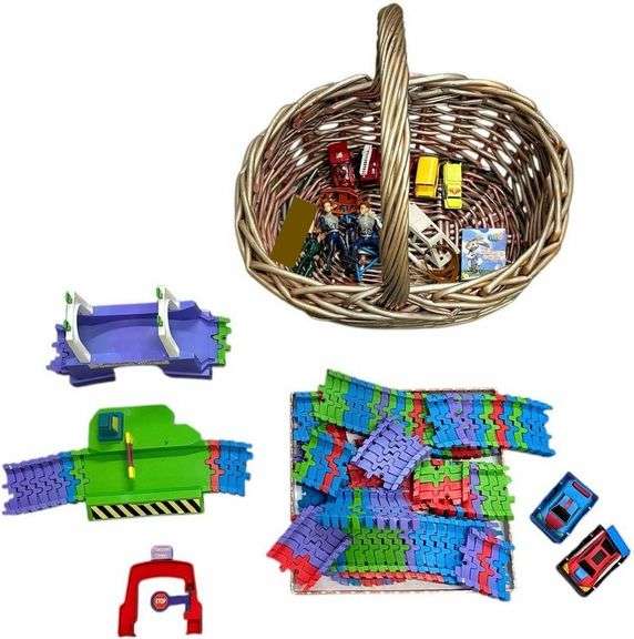 ASSORTED PLANET TRAX BY PLANET TOYS TRACK W/ 2 CARS, OTHER SMALL ASSORTMENT OF TOYS IN WOVEN BASKET TO INCLUDE 2 MCDONALD’S SHARK BOY ACTION FIGURES, VEHICLES, MEMORY CARDS, ETC. image