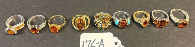 9 STERLING SILVER RINGS W/ AMBER STONES, VARYING STYLES - 39.54 GRAMS, 1.27 TROY OZ - SIZES 5-8 image