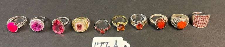 10 STERLING SILVER RINGS W/ PINK SAPPHIRE AND OTHER RED STONES, VARYING DESIGNS - 1.81 TROY OZ, 56.55 GRAMS - SIZES RANGE FROM 5-8 image