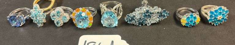 8 STERLING SILVER RINGS, SOME SKY BLUE TOPAZ AND OTHER BLUE STONES, VARYING STYLES - 1.62 TROY OZ, 50.64 GRAMS - SIZES FROM 5-7 image