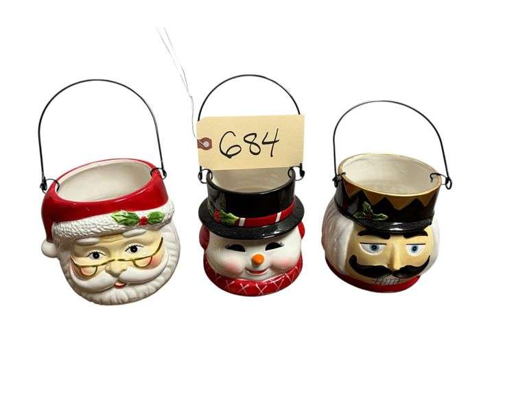 SET OF CERAMIC CANDLE HOLDERS WITH METAL HANDLES: SANTA HEAD, SNOWMAN HEAD AND NUTCRACKER HEAD image