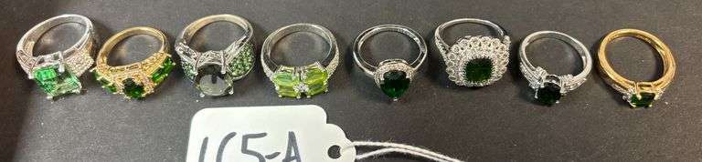 8 STERLING RINGS W/ EMERALD GREEN STYLE STONES - 1.14 TROY OZ, 35.58 GRAMS - SIZES RANGE FROM 6-7 image