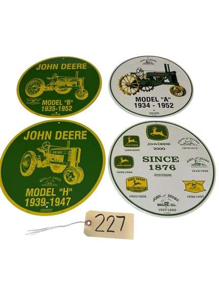 4 METALLIC EMBOSSED JOHN DEERE SIGNS APPROX. 11.75” DIAMETER image