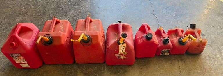 8 GAS CANS OF ASSORTED SIZES image