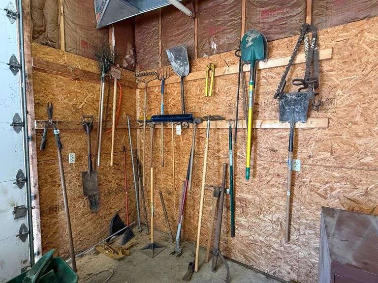 LARGE LOT OF GARDENING TOOLS TO INCLUDE SHOVELS, PICKS, HOSE, SLEDGEHAMMER, BROOMS, RAKES image