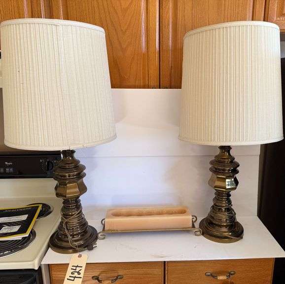 TWO TABLE LAMPS AND A CANDLE ON A STAND image