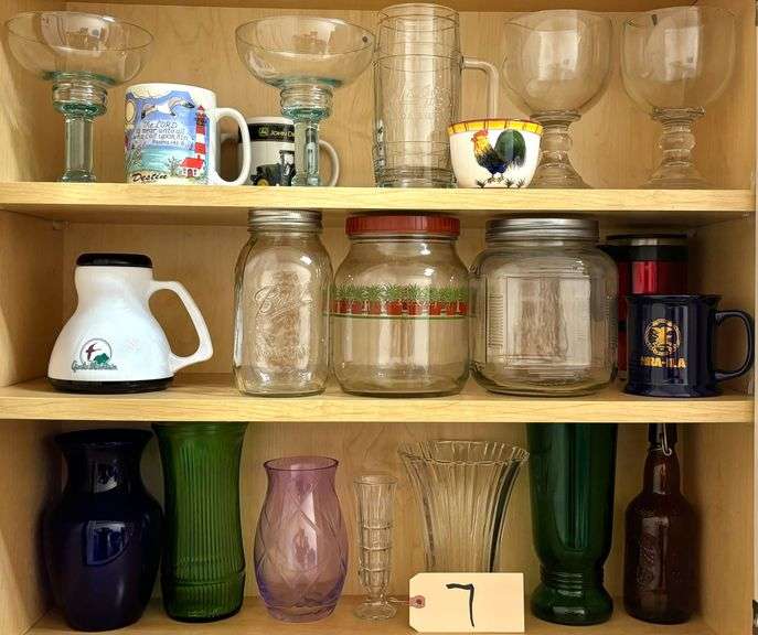 ASSORTMENT OF GLASS: COLORED VASES, COFFEE MUGS, CANISTERS WITH LIDS, 2 GREEN GLASS MARGARITA GLASSES, 2 STEMMED CLEAR MARGARITA GLASSES image