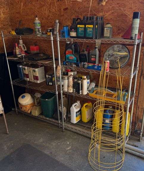 PAIR OF FOUR SHELF STAINLESS STEEL SHELVES WITH CONTENTS TO INCLUDE TIRE SEALANT, DUST PANS, THERMOMETER, OIL COOLANT AND TOMATO CAGES image