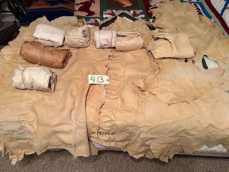 APPROXIMATELY 11 DEER HIDES, ASSORTED SIZES image