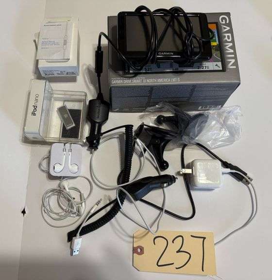GARMIN GPS NAVIGATOR, 2 PAIRS OF AIR BUDS, LIGHTNING CHARGER, 2 IPODS, CIGARETTE LIGHTER MICRO USB, USB-TO-EARBUD JACK image