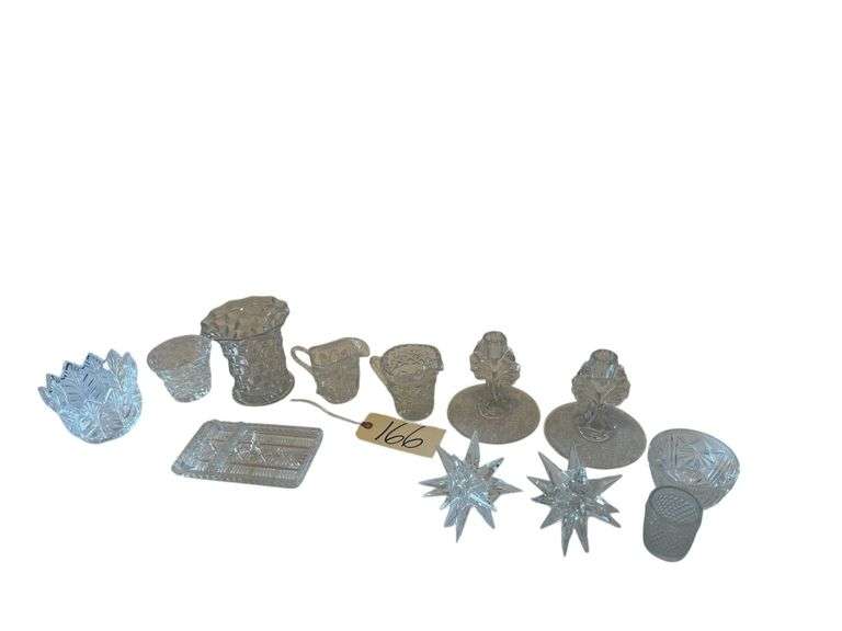 PRESSED GLASS CREAM AND SUGAR, PAIR OF PATTERN GLASS CANDLEHOLDERS, PATTERN GLASS VASE, 2 DECORATIVE GLASS SNOWFLAKES, PATTERN GLASS BUTTER DISH, ETC. image