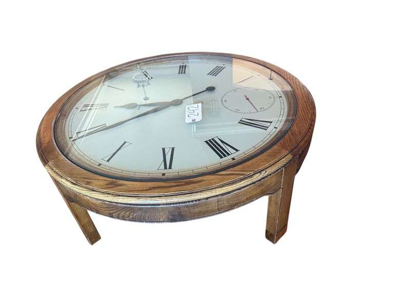 HOWARD MILLER WOODEN COFFEE TABLE CLOCK - CLOCK APPEARS TO BE WORKING - APPROX. 41.5” DIAMETER X 16.5” TALL image