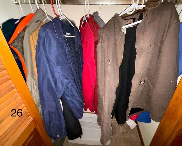 LOT OF ASSORTED MEN’S CLOTHING TO INCLUDE: WALLS COVERALLS, BIG SMITH JACKET 2XL, COLUMBIA 2XL LIGHT JACKET, PORT AUTHORITY 3XL VEST, COLUMBIA RAIN JACKET XL, CARHARTT 2XL JACKET, ST. JOHN’S BAY JACKET 2XL, ETC.
