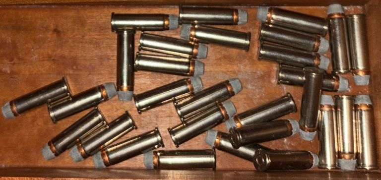 WOODEN GUN RACK WITH TWO DRAWERS - INCLUDES SHOTGUN SHELLS AND BULLETS FOUND IN DRAWERS (MOSTLY AS-FOUND)