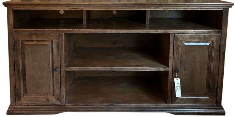WOODEN ENTERTAINMENT STAND WITH THREE UPPER CUBBIES, TWO CABINET DOORS, AND CENTER SHELVING image