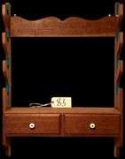 WOODEN GUN RACK WITH TWO DRAWERS - INCLUDES SHOTGUN SHELLS AND BULLETS FOUND IN DRAWERS (MOSTLY AS-FOUND)