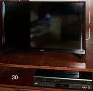 WOODEN FOUR-DOOR ENTERTAINMENT ARMOIRE APPROX. 62" HEIGHT X 42" WIDTH X 22" DEEP WITH CONTENTS TO INCLUDE 32 INCH SAMSUNG TELEVISION AND JVC VHS PLAYER (JVC SPEAKERS AND STEREO PLAYER NOT INCLUDED)