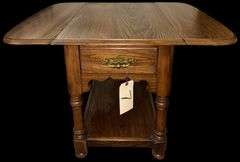 APPEARS TO BE OAK DROP-LEAF END TABLE WITH DRAWER AND BRASS PULL