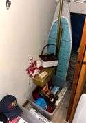 CLOSET LOT TO INCLUDE SUNBEAM ELECTRIC IRON, BLACK & DECKER ELECTRIC IRON, IRONING BOARD, FLASHLIGHT, VINTAGE SPACE HEATER, DECORATIVE WOVEN BASKET, SHOE TOOL, FLORA DIAMONDS PATCHWORK QUILTS BEDSPREAD, HOMEDICS PROFESSIONAL PERCUSSION MASSAGER, LED LANTERN, ETC.