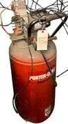 PORTER CABLE VERTICAL AIR COMPRESSOR WITH GE 5 HP 120V SINGLE PHASE MOTOR RATED AT 3450 RPM ON WHEELS