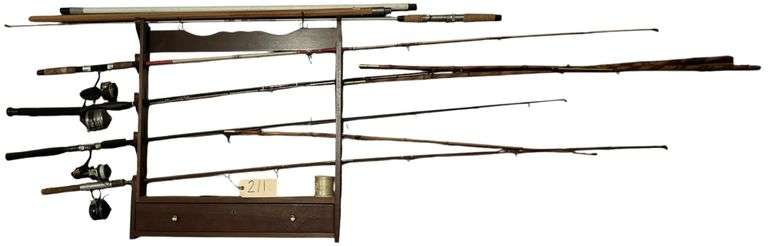 ONE-DRAWER WOODEN GUN RACK WITH KEY & FISHING RODS WITH REELS: SHAKESPEARE 2440 PRO TOUCH REEL, ZEBCO MEASURIN’ STIK WITH ZEBCO REEL, GLADDING SOUTH BEND WHITE KNIGHT ROD WITH MITCHEL GARCIA 300 REEL, CANE POLE, AND ASSORTED OTHER RODS; WILLIAMS TACKLE BOX WITH VINTAGE REBEL BAIT IN ORIGINAL PACKAGE; OTHER ASSORTED BOBBERS, HOOKS, ETC. image