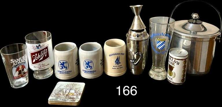 TWO VINTAGE LOWENBRAU MUCHEN GERMAN BREWERY AIR BASE CERAMIC STONEWARE MUGS, OCTOBER FEST NCO CLUB HAHN AIR BASE MUG, VINTAGE SCHLITZ 32OZ PEDESTAL BEER GLASS "THE BEER THAT MADE MILWAUKEE FAMOUS" MUG, WORLD'S FAIR 1982 UNOPENED BEER CAN, SAMUEL ADAM’S PINT GLASS, FOUR "THE OLD CRUST MILL" CURRIER AND IVES COASTERS, WEIHENSTEPHANER LITER WEIAENBIER BEER GLASS, METAL ICE BUCKET, METAL DRINK MIXER image