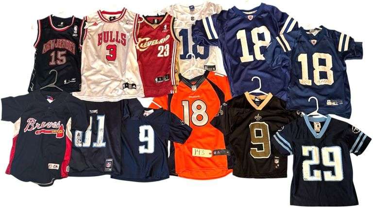 ASSORTMENT OF YOUTH JERSEYS: 3 PEYTON MANNING - 2 IN GOOD CONDITION; ANDRUW JONES, VINCE CARTER, DREW BREES, LEBRON JAMES, BEN WALLACE, AND OTHERS - SOME IN GOOD CONDITION, SOME AS-FOUND image