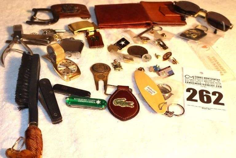 Variety of Men's items: Wallet, Belt Buckles, Brush, Lighter, Knives, Keychains, Pins, Sunglasses, Etc. image