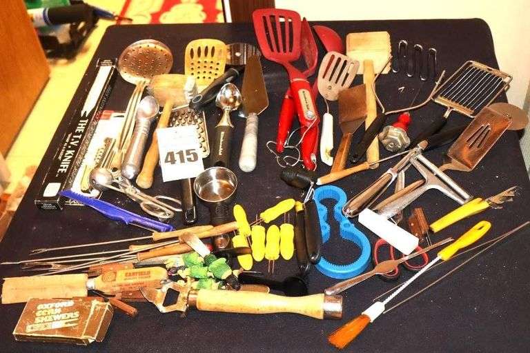 Variety of Kitchen Utensils: set of Kitchenadi spatula, spoon, grater, corn holders, spoons, ice cream scoop, Can Opener, Cheese Slice, Pie Server etc. image
