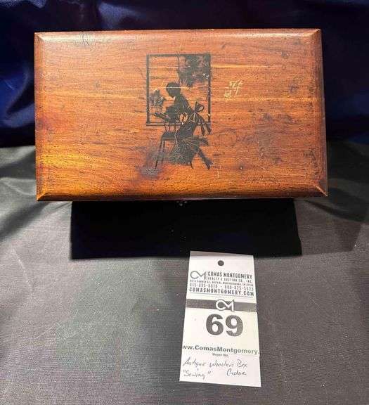 Vintage Art Deco Wood Box with A Black Picture on the Lid. image
