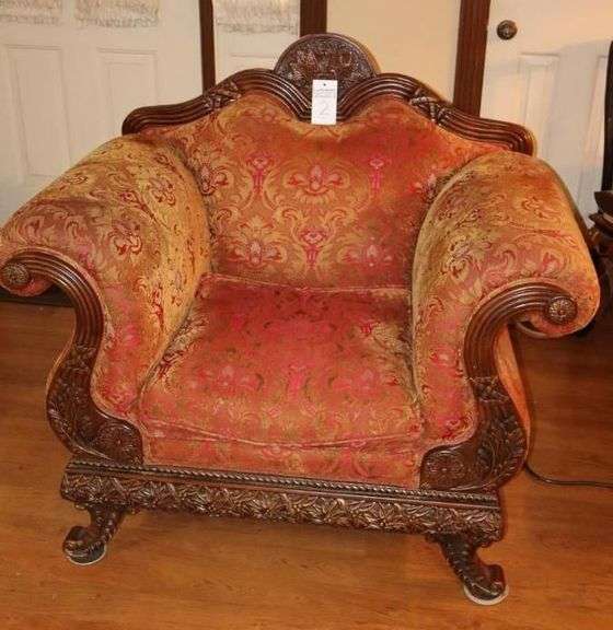 Antique Wood Carved Victorian Styled Chair (41"x46"x22") with decorative upholstery and curved arms and camel back with carved legs                               **Matching Lot #1 image