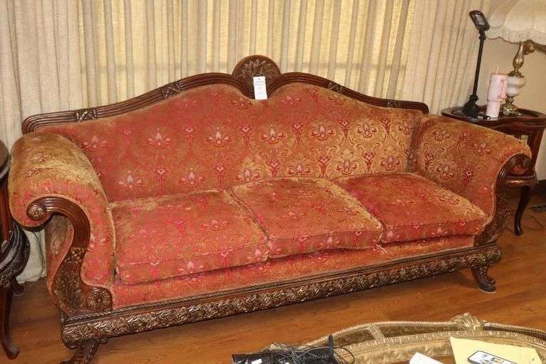 Antique Wood Carved Victorian Styled Sofa(44"x94"x24") with decorative upholstery and curved arms and camel back with carved legs                               **Matching Lot #2 image