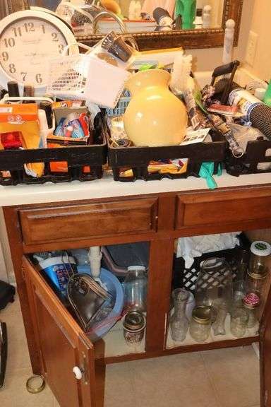 All Items on & in Cabinet: Cleaning supplies, Shoe Shine items, Clock, Vases, Jars, Rags, cabinet liners, wash pans, brushes    **Buyer bring boxes to remove image