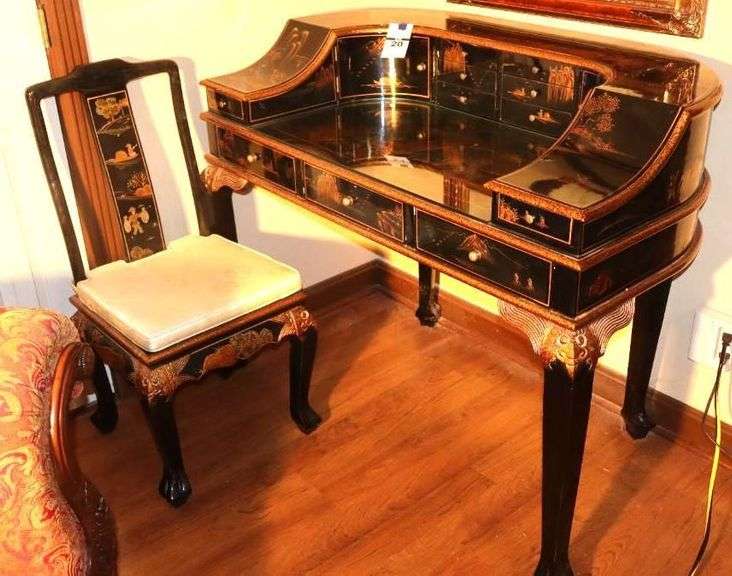 Unique Vintage Chinese Chinoiserie Design Gold and Black Lacquered finish  Desk (41"x50"x19")and Matching Chair (40"x23"x18") with curved front sides and multiple draws and stationary slots with ornate gold tone accents on desk and chair - with mother of pearl accent image