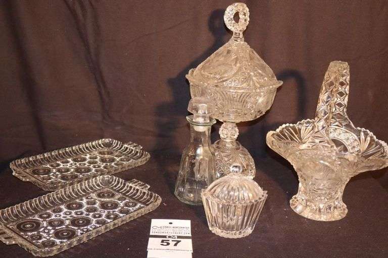 Variety of Glass/Crystal serving Items: Glass Basket, Pedestal Lidded Bowl (both with matching Bird Design) 2 Trays, Lidded Bowl, oil jar with lid image