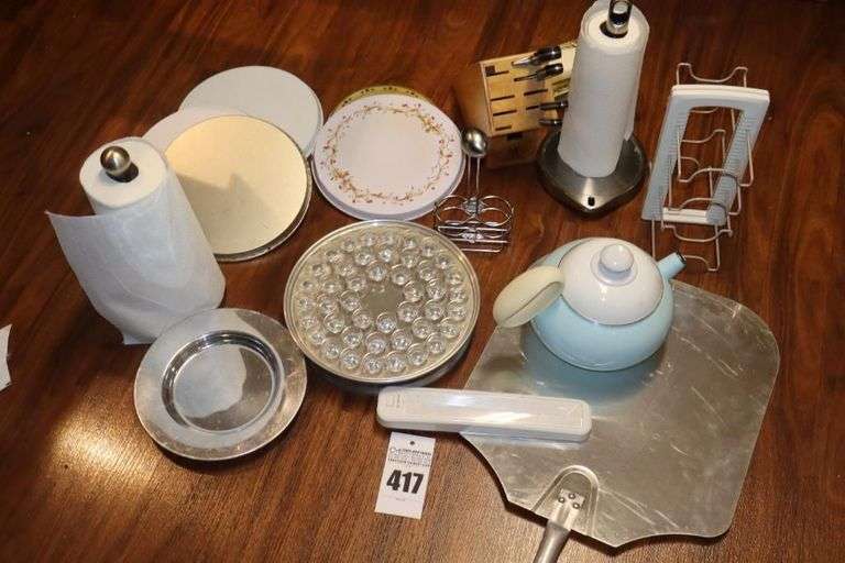 Variety of Items: Communion Set with holder, cups and plate,  Tea Pot, 2 Paper Towel Holders, Ikea Tower, Burner Covers (more than one set), Knife Block with a few knives, XL Pizza Pie spatula Cup and plate etc. image