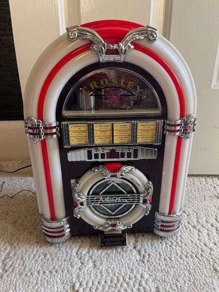 Crosley Mini Jukebox Portable Bluetooth Speaker, a Compact Audio Device Designed with a Retro Aesthetic. image