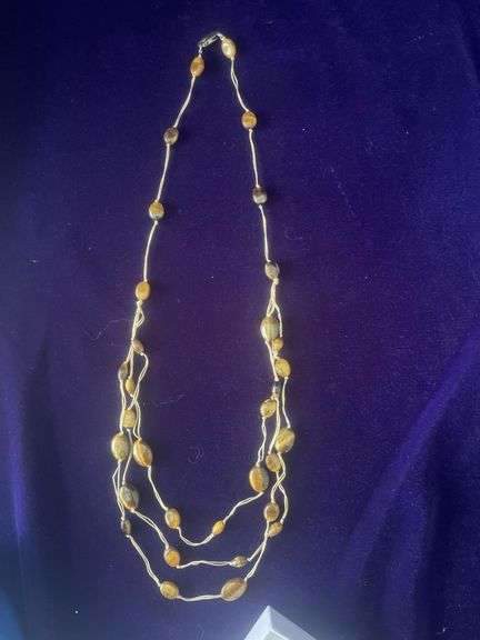Multi-Strand Beaded Necklace with what appears to be Tiger's Eye Stones on a White Cord image