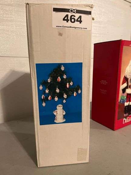 Snowman Holding a Christmas Tree with Decorations image